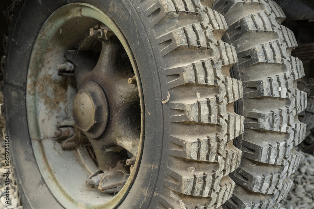 the wheel of an old army car