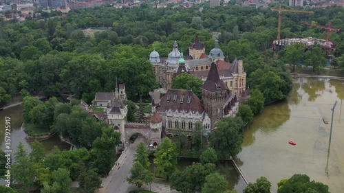 Beautiful views of Vajdahunyad Castle. In front of it is the city park, the boating lake. Tourist attraction without tourists in the coronavirus period. Drone recording.