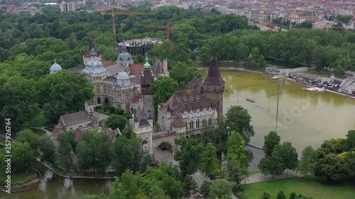 Beautiful views of Vajdahunyad Castle. In front of it is the city park, the boating lake. Tourist attraction without tourists in the coronavirus period. Drone recording.