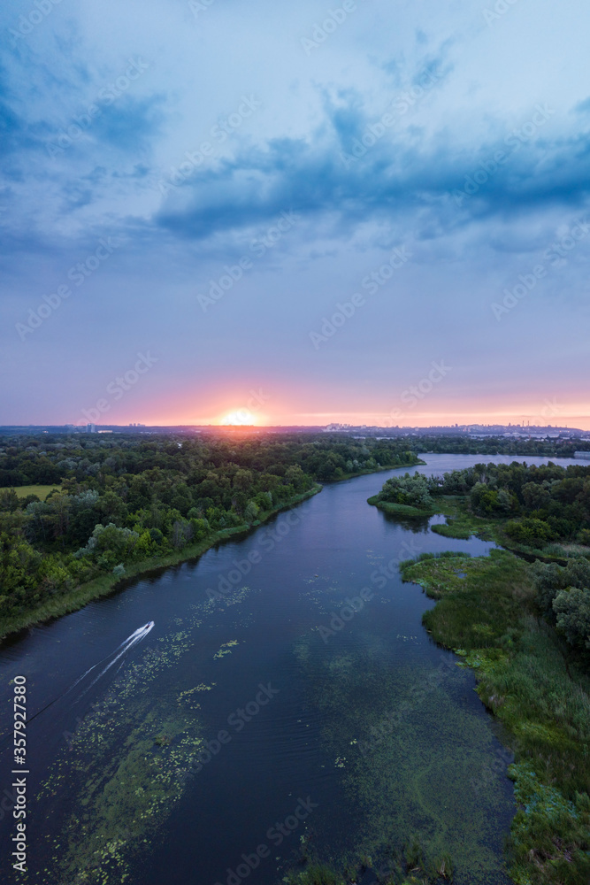 amazing landscape at sunset. aerial view of river and blue cloudy sky. natural background. drone shot