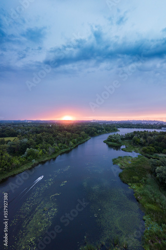 amazing landscape at sunset. aerial view of river and blue cloudy sky. natural background. drone shot