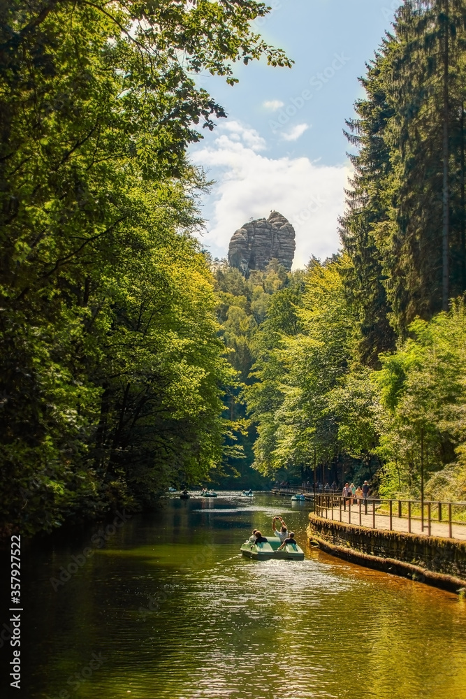 Naklejka premium Rock formation called the valley guardians over Lake Amselsee in Saxon Switzerland
