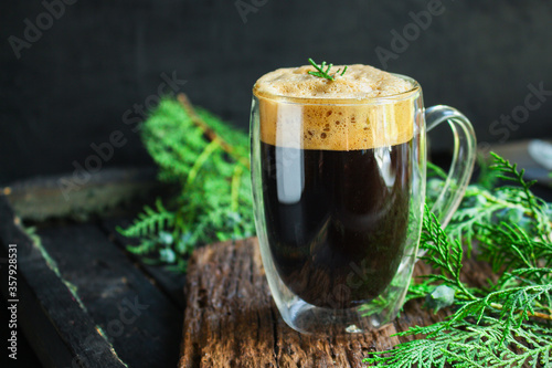 cup of coffee and twigs spruce on the table, new year mood Menu concept serving size. food background top view copy space for text