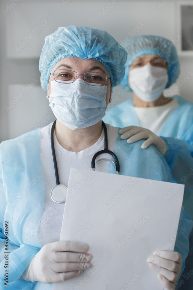 Healthcare and medical concept. Covid-19. Female doctors wearing medical protective suits. Team work. Virus Concept Healthcare and medical concept. Covid-19. Female doctors wearing medical protective suits. Team work. Virus Concept