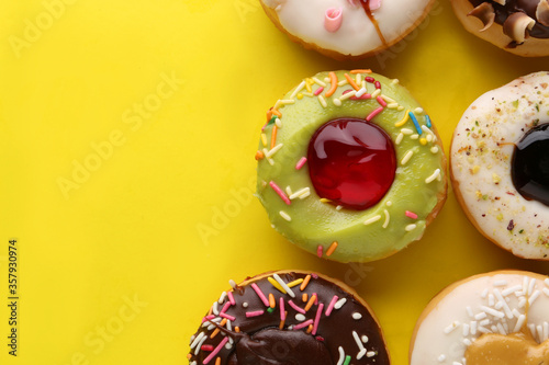  donut decorated with colorful sprinkles isolated on white background. Flat lay. Top view
