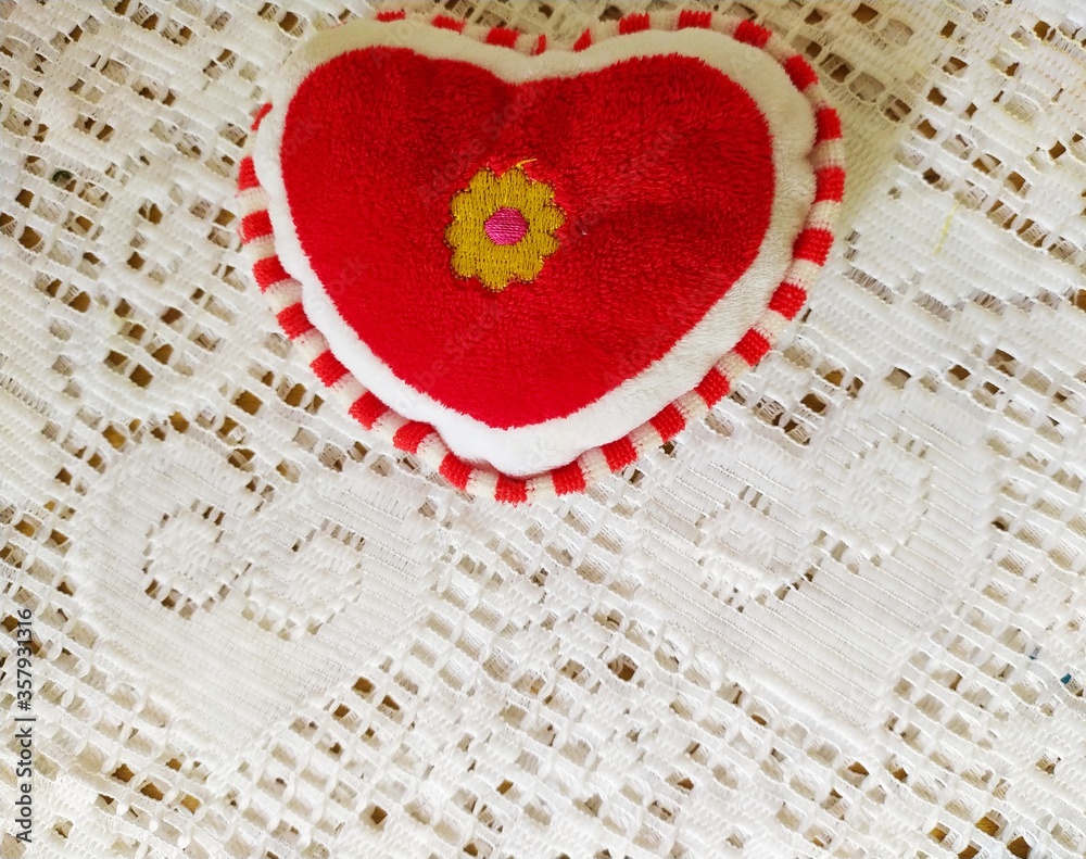 red toy  heart with lace