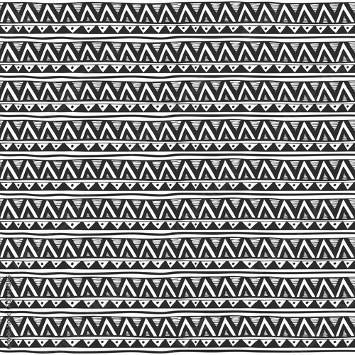 Seamless ornament from triangle geometric elements in zen ethnic style black and white
