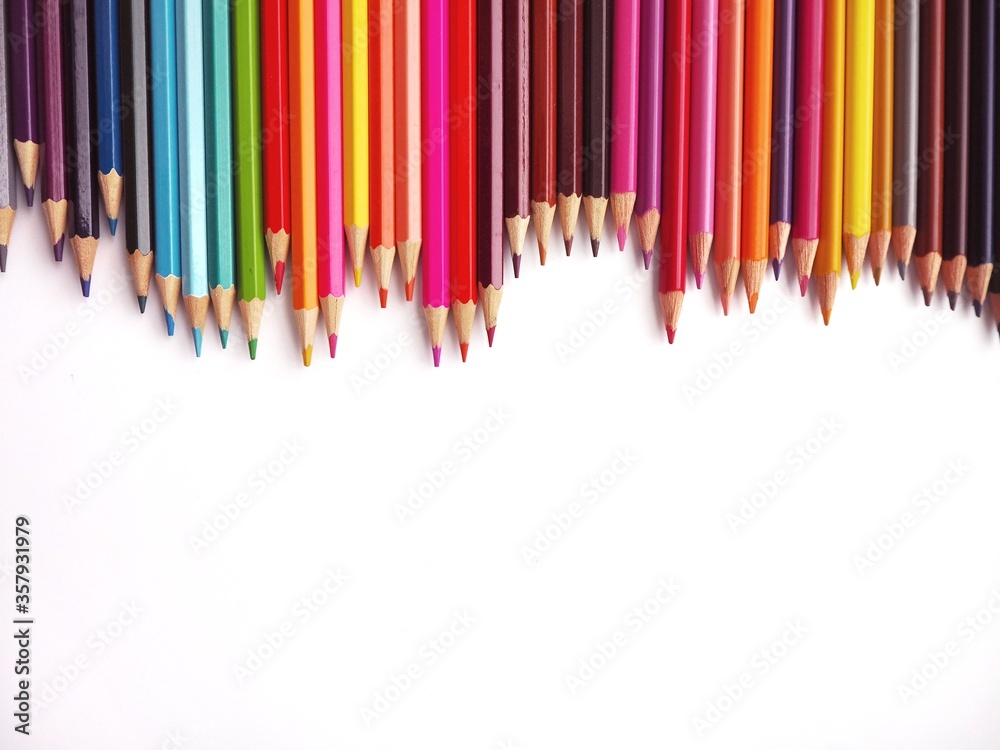 The education concept, Color pencils with copy space on isolated white background. The education concept, Color pencils with copy space on isolated white background.