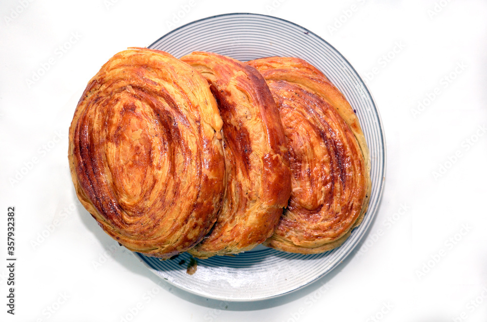 Gogal Traditional Azerbaijani Cookie on Novruz Easter . Novruz holiday with Azerbaijan national pastry Gogal and glass . Fresh pastries Gogal isolated on white background. Gogal Traditional Azerbaijani Cookie on Novruz Easter . Novruz holiday with Azerbaijan national pastry Gogal and glass . Fresh pastries Gogal isolated on white background.
