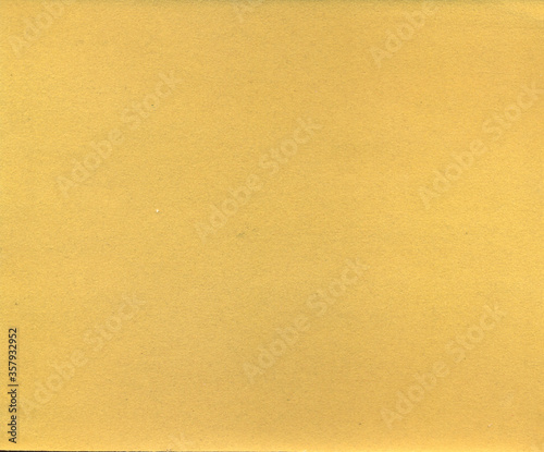 Yellow background. Velvet fleecy paper texture. Closeup