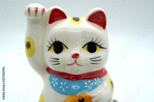 Japanese white Maneki Neko lucky cat bank close-up head © Julia