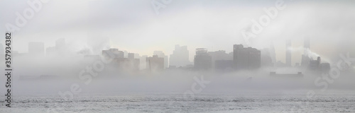 Panoramic view of midtown Manhattan skyline shrouded in mist. New York. USA. © alexzosimov