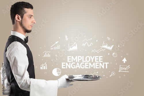 Waiter serving business idea concept with EMPLOYEE ENGAGEMENT inscription