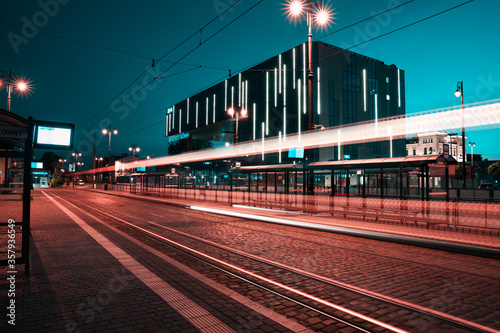 Main train station in Bydgoszcz after sunset. Blue hour. Moder train station illuminated by city lights.