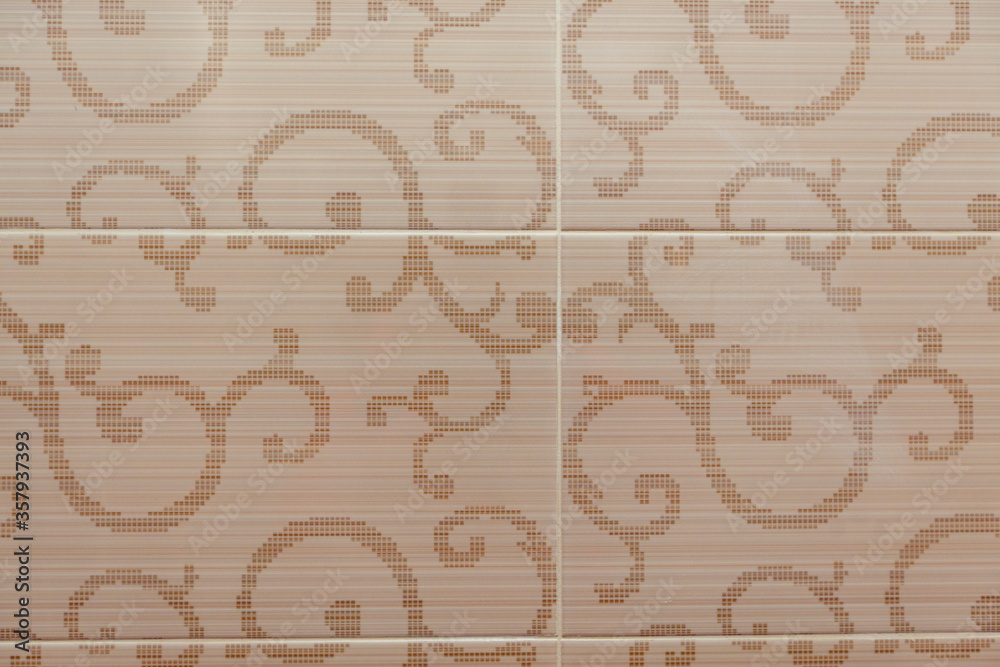 Beige ceramic tile with a plant pattern