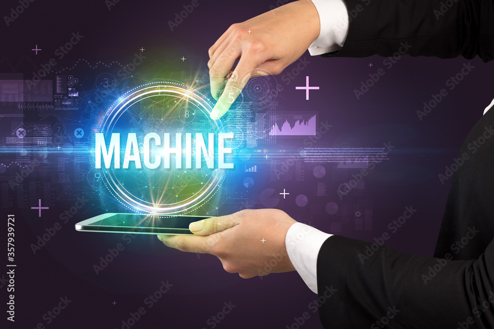 Close-up of a touchscreen with MACHINE inscription, new technology concept Close-up of a touchscreen with MACHINE inscription, new technology concept