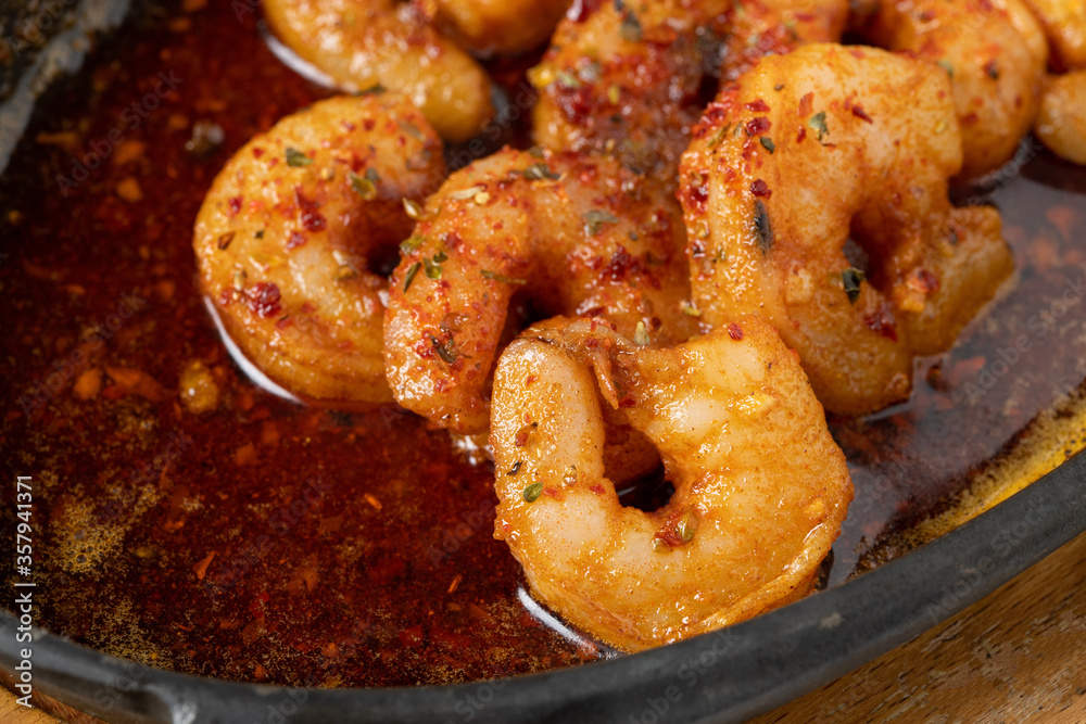 Roasted (fried) big shrimps in tomato sauce with olive oil, garlic, cilantro and soy sauce...