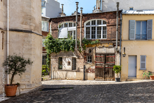 Fototapeta Naklejka Na Ścianę i Meble -  Paris, France - May 26, 2020: L'îlot de la Reine Blanche is a collection of buildings located in the 13th arrondissement of Paris, near the Gobelins factory