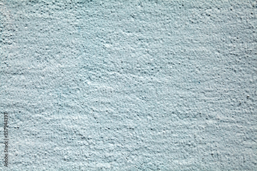 Texture of wall with rough stucco in blue color.