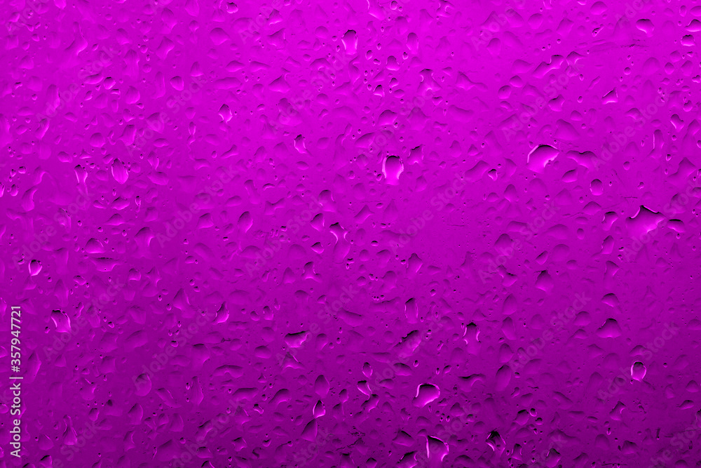 Water drops on glass with vivid medium contrast lilac color Water drops on glass with vivid medium contrast lilac color