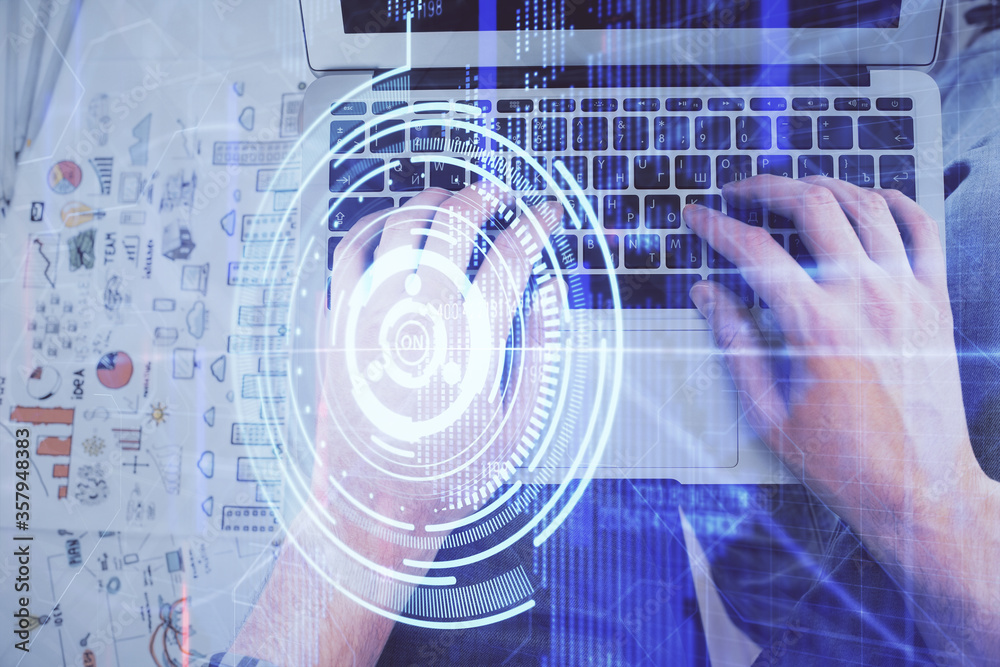 Multi exposure of man's hands typing over computer keyboard and data theme hologram drawing. Top view. Technology concept. Multi exposure of man's hands typing over computer keyboard and data theme hologram drawing. Top view. Technology concept.