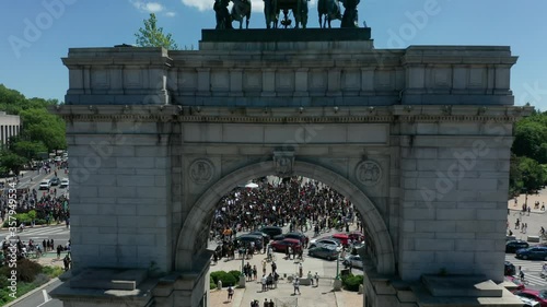 rising over arch reveal of huge BLM protest in Grand Army Plaza Brooklyn photo