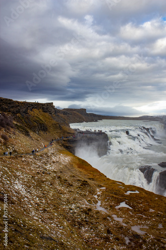 A Hiking Trail Winds through the Tundra Covered Cliffs at the Gulfoss Waterfall in the Golden Circle of Iceland