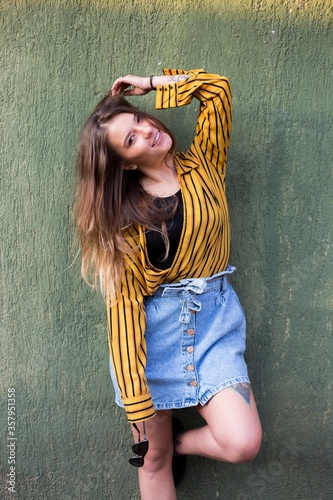 happy young woman on a green background