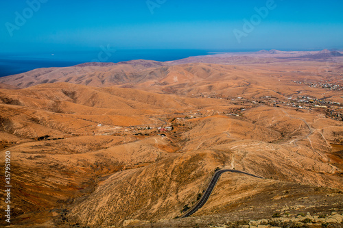 Landscape of Panoramic vulcanic mountains and Atlantic Ocean ,  dunes of coralejo and Gran Tarajal Port in Fuerteventura, Lanzarote  photo