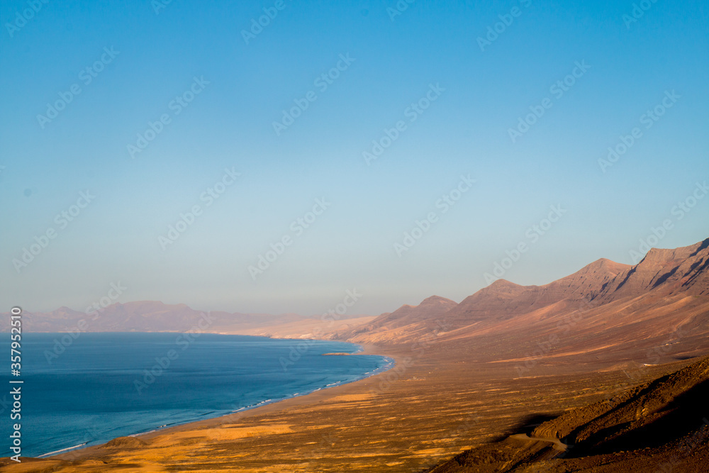 Landscape of Panoramic vulcanic mountains and Atlantic Ocean ,  dunes of coralejo and Gran Tarajal Port in Fuerteventura, Lanzarote 