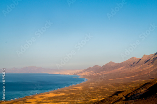 Landscape of Panoramic vulcanic mountains and Atlantic Ocean , dunes of coralejo and Gran Tarajal Port in Fuerteventura, Lanzarote 