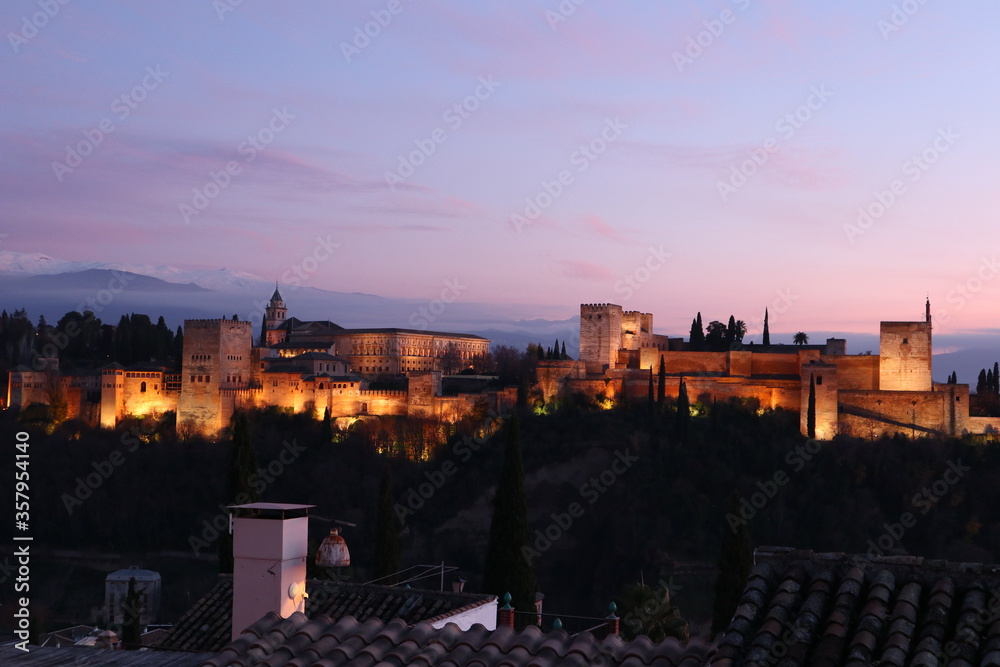 View of the Alhambra Palace at dusk from Mirador de San Nicolás (Granada, Spain)