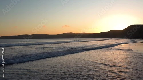 Sunset view of the Pacific Ocean shoreline; Drakes Beach, Point Reyes National Shoreline, California