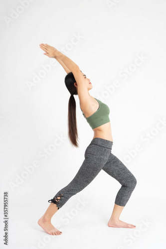 Young woman exercise yoga on white background 