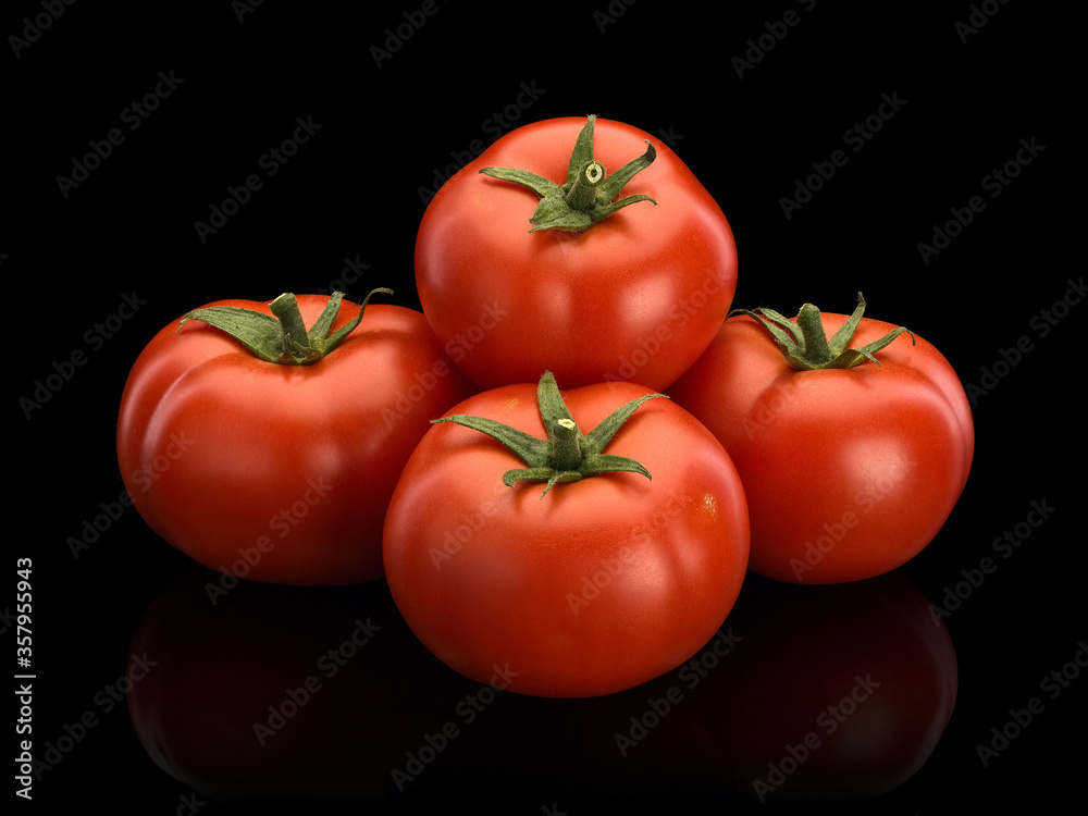 Pyramid combined from five ripe tomatoes Pyramid combined from five ripe tomatoes