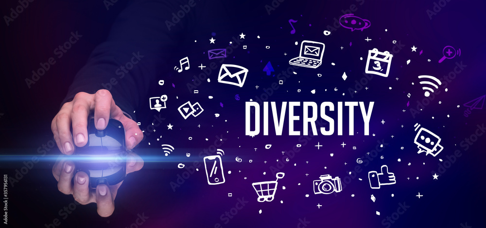 hand holding wireless peripheral with DIVERSITY inscription, social media concept hand holding wireless peripheral with DIVERSITY inscription, social media concept