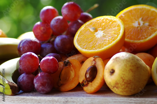 Slices of loquat fruits  grapes and citric fruits
