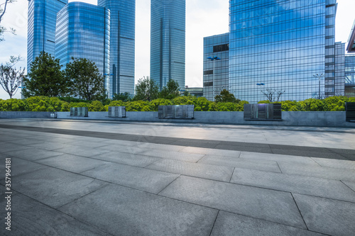 empty square and city skyline under blue sky, suzhou city, china.