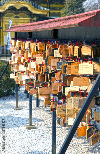 The Ueno Toshugu Shrine is located in Ueno Park in Tokyo, Japan and is brightly gold in colour. photo