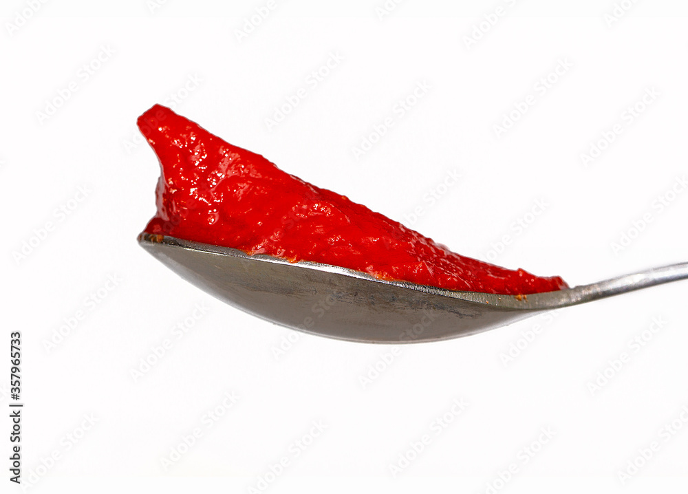 red tomato on a spoon red tomato on a spoon