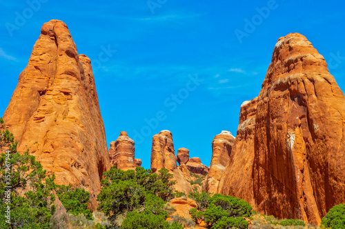 Clear vibrant red cliffs that are sporadically found around Arches National Park