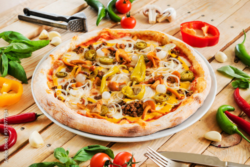 fresh pizza on the wooden background