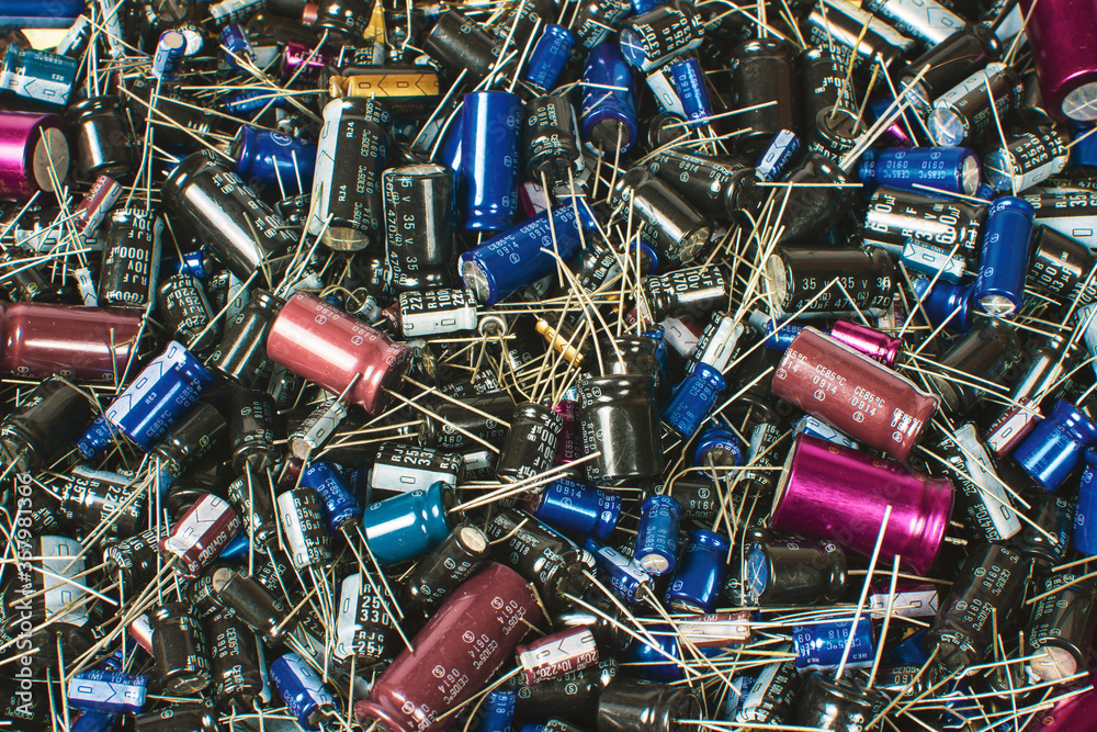Close up of Electrolytic capacitor heap with various sizes background