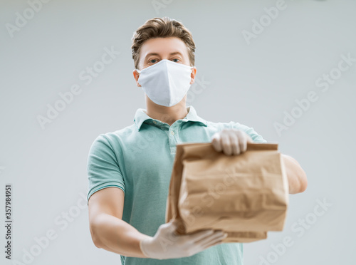 Delivery man holding packages