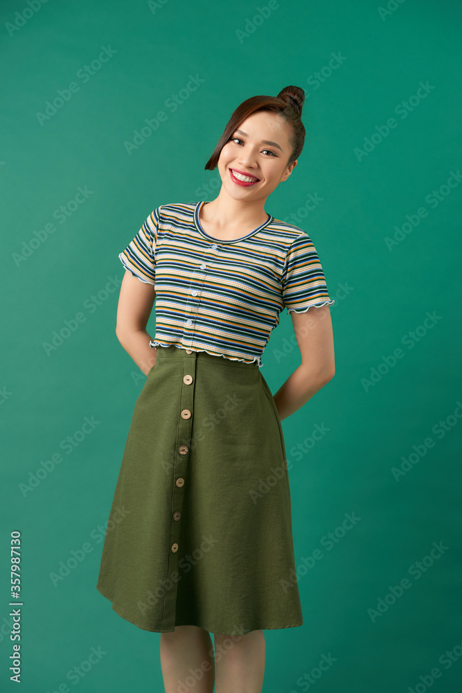 Portrait of beautiful young woman on green background Portrait of beautiful young woman on green background