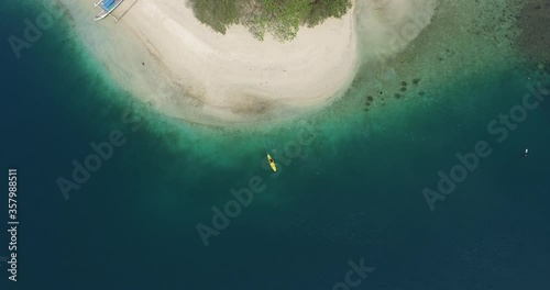 Lombok Indonesia June 3, 2020 :  Tourist swimming in tropical island with white sandy beach and blue transparent water, Gili Lombok Indoneseia photo