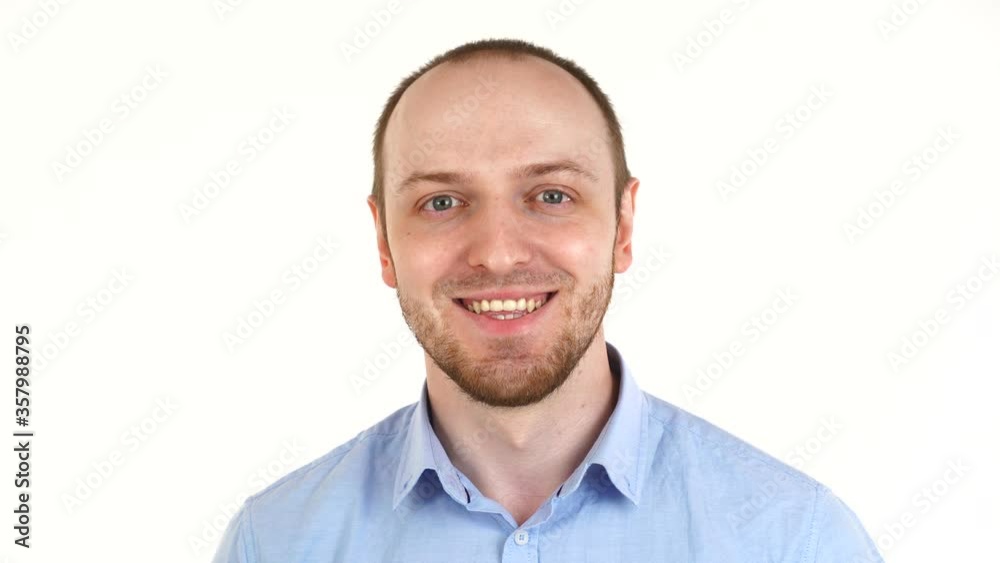 Handsome european man smiling. Portrait of guy in shirt over white background Handsome european man smiling. Portrait of guy in shirt over white background