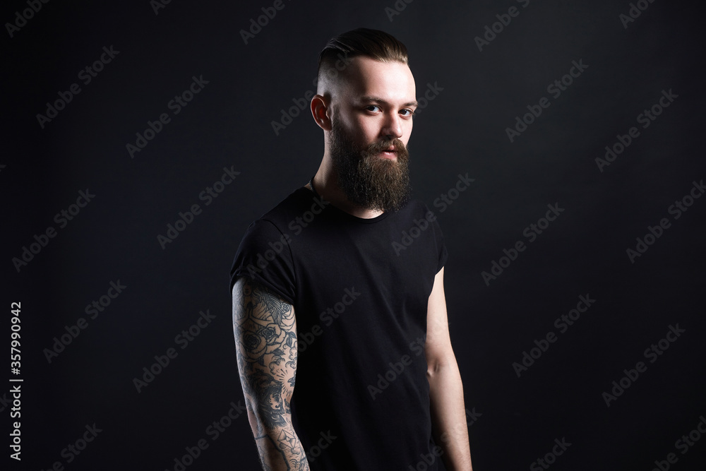 Naklejka premium Boy with stylish haircut and tattoo. handsome Man