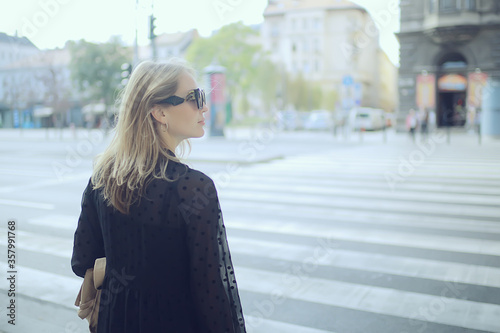 spring portrait of a girl with beautiful bokeh, happy beautiful woman on a walk © kichigin19