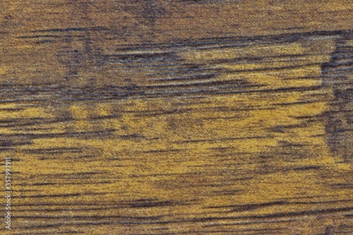 Textured plain wooden background, brown and yellow tones. Macro abstract weathered look, Western feel with room for text.